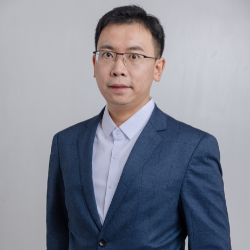 man wearing eye glasses and blue suit